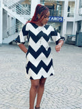 Off~ white on black shift dress